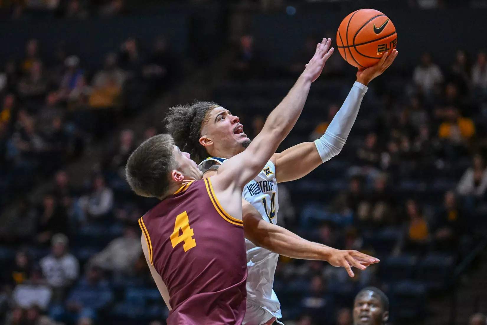 Game action of WVU vs University of Charleston Friday night at the WVU Coliseum.
