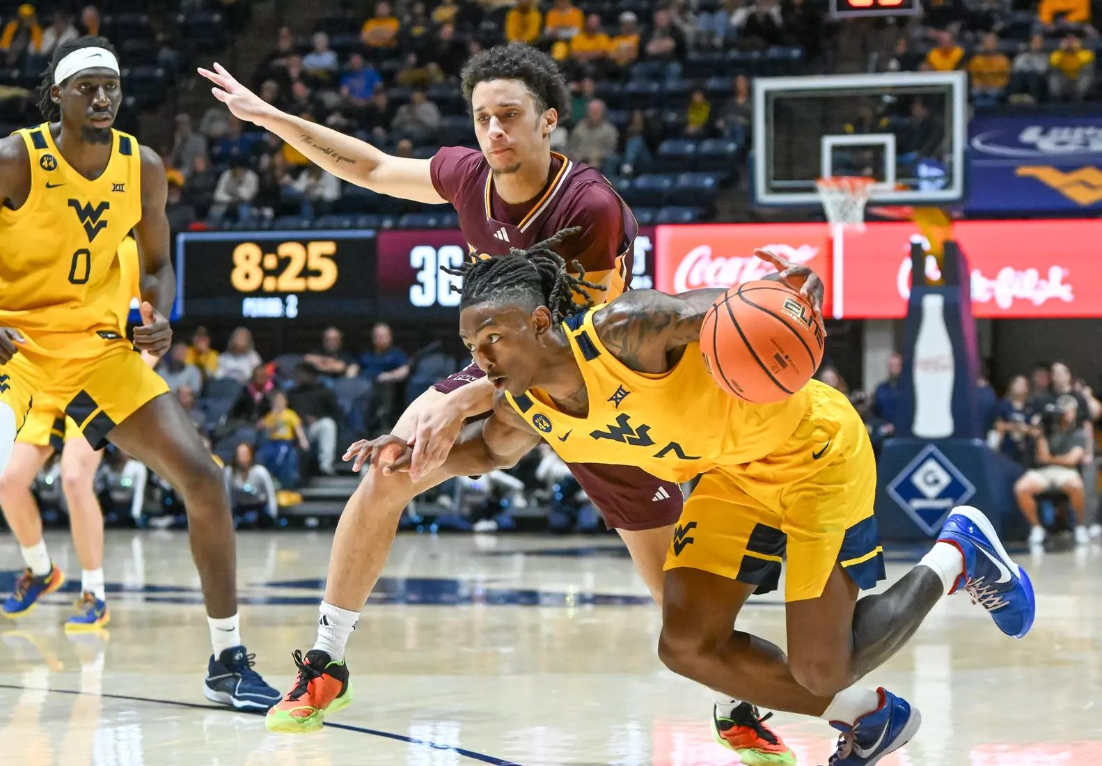 WVU vs Iona action Wednesday night at the WVU Coliseum.