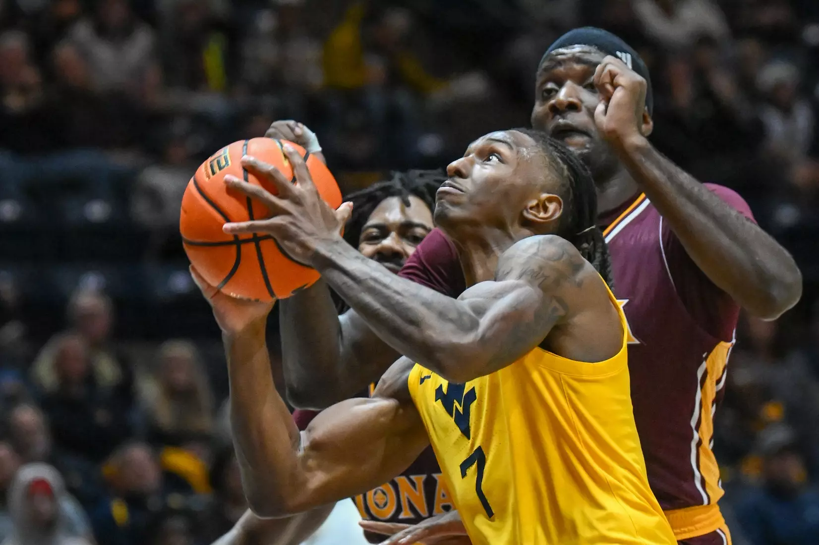 WVU vs Iona action Wednesday night at the WVU Coliseum.