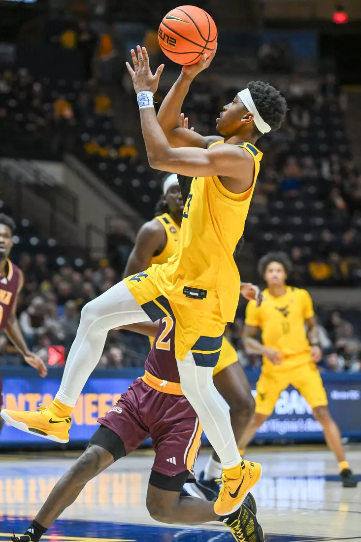 WVU vs Iona action Wednesday night at the WVU Coliseum.