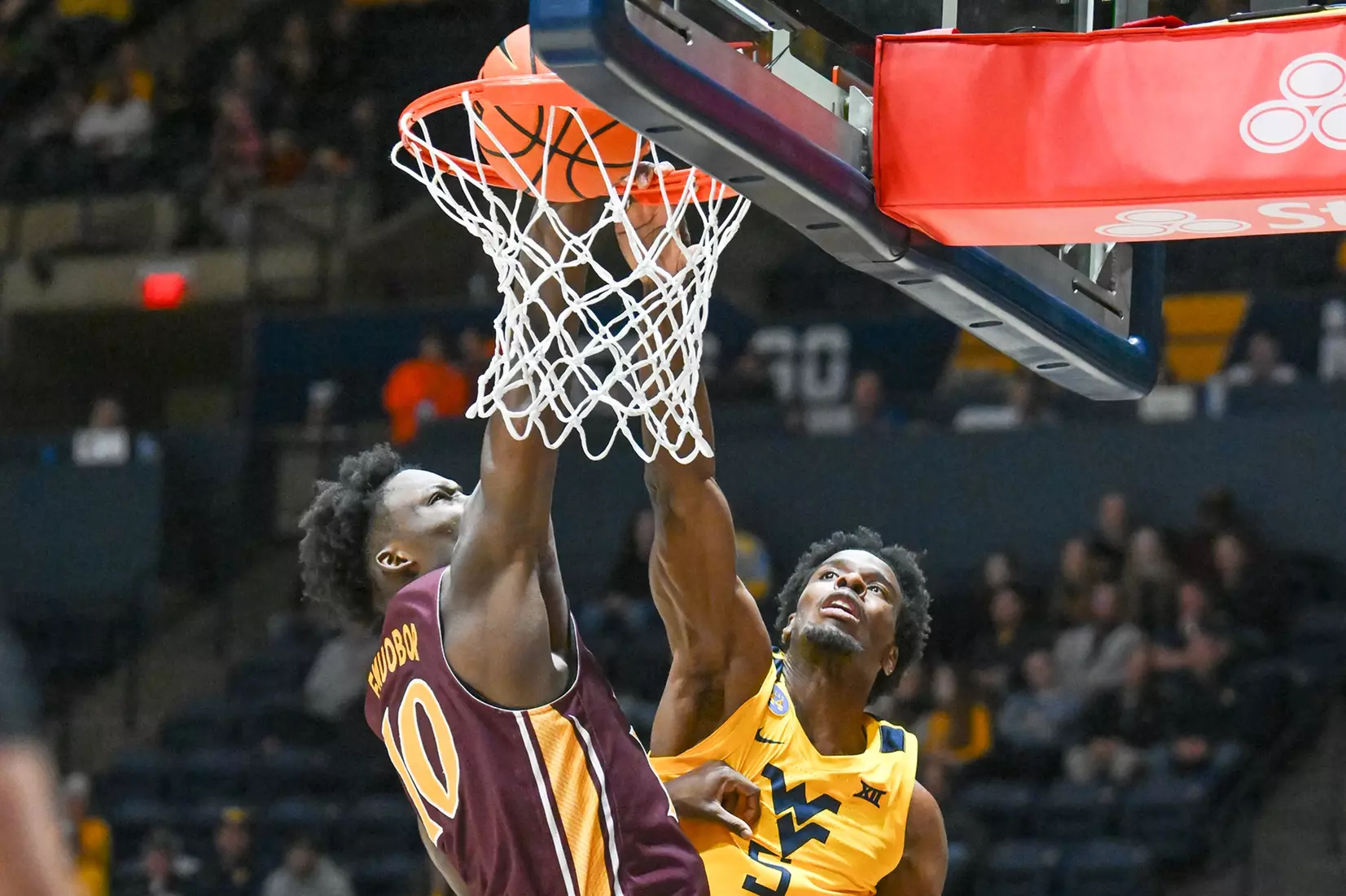 WVU vs Iona action Wednesday night at the WVU Coliseum.