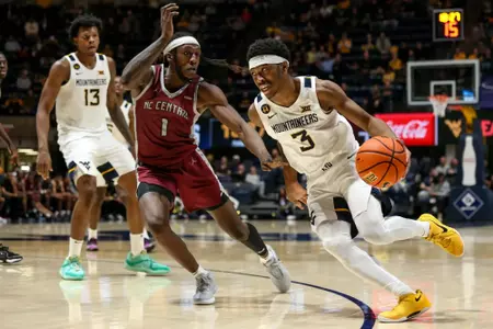 West Virginia Mountaineers guard KJ Tenner (3) drives to the net on Tuesday, December 10, 2024 William Wotring