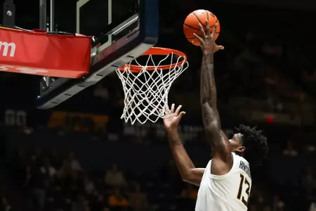 West Virginia Mountaineers forward Amani Hansberry (13) makes a layup on Tuesday, December 10, 2024 William Wotring