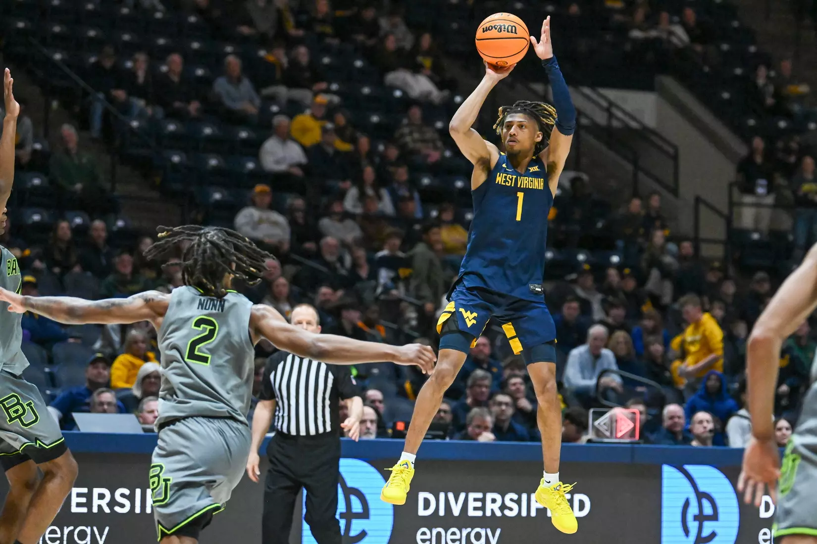 Noah Farrakhan shoots a three-pointer.