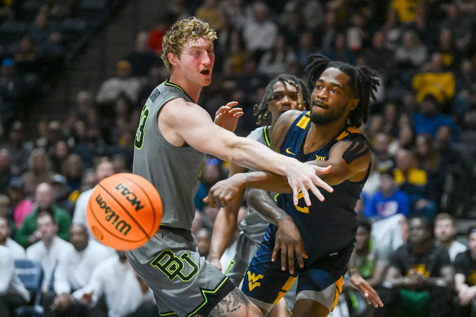 Kobe Johnson passes around a defender.