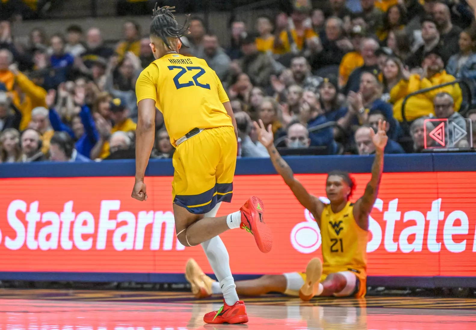 RaeQuan Battle celebrates Josiah Harris' three.