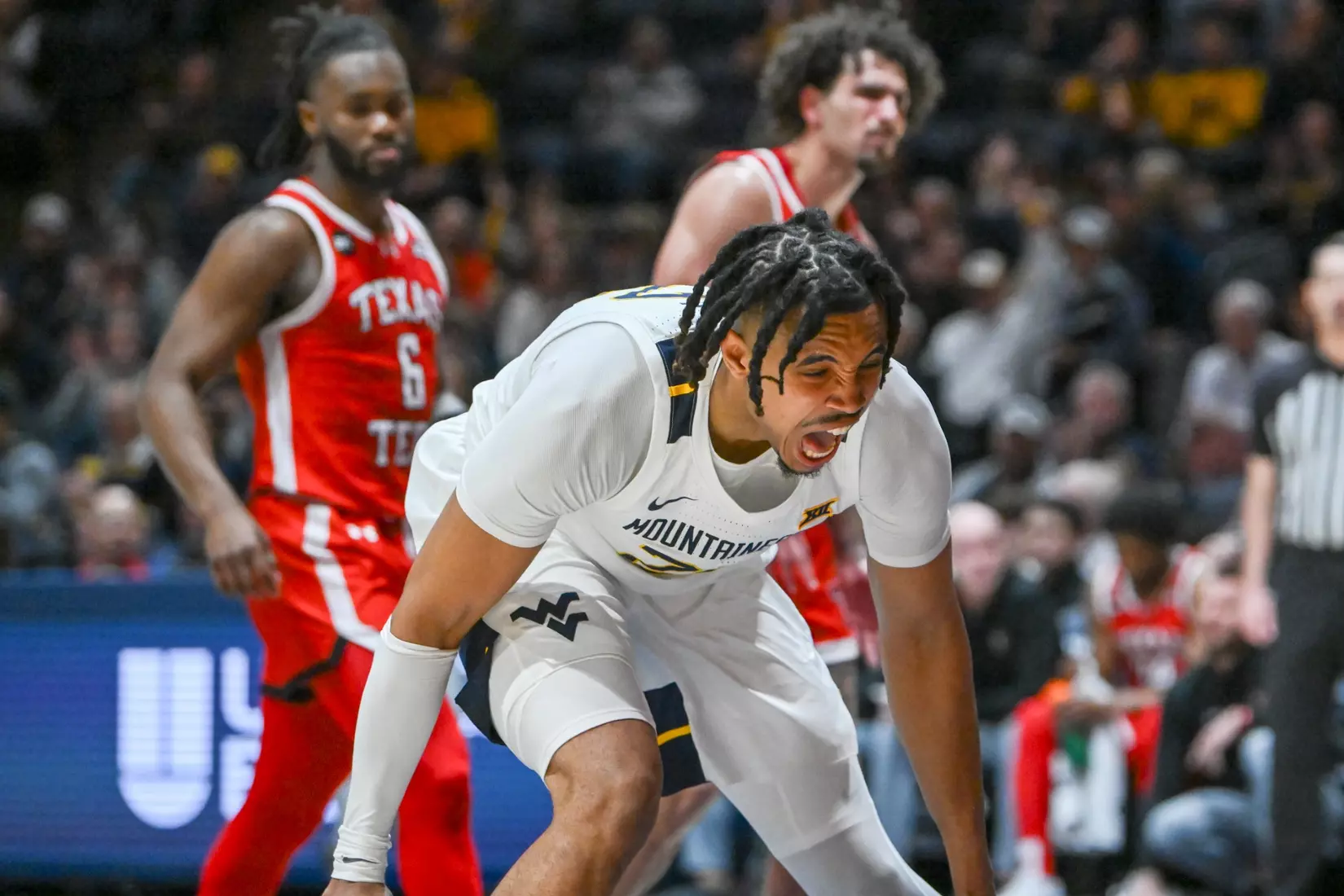 Josiah Harris celebrates his slam dunk.