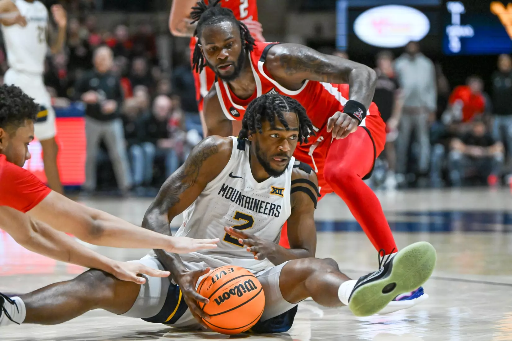 Kobe Johnson fights for control of the loose ball.