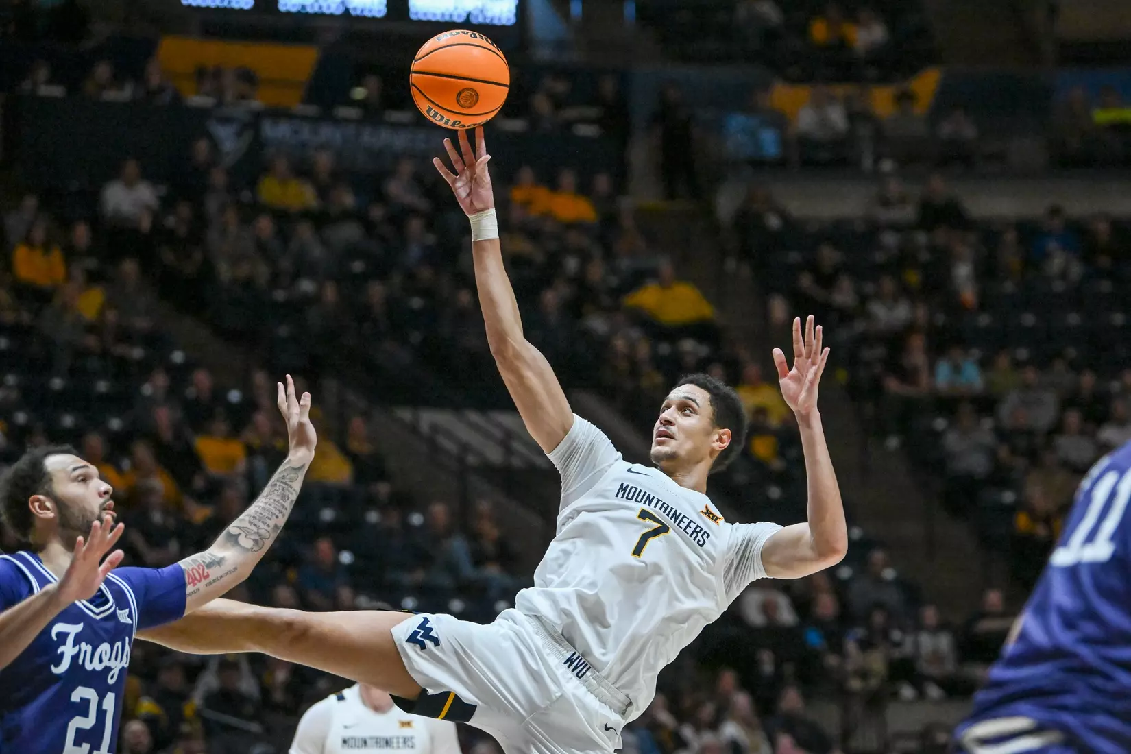 Jesse Edwards is fouled while shooting.
