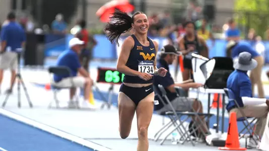 Mikenna Vanderheyden crossing the finish line