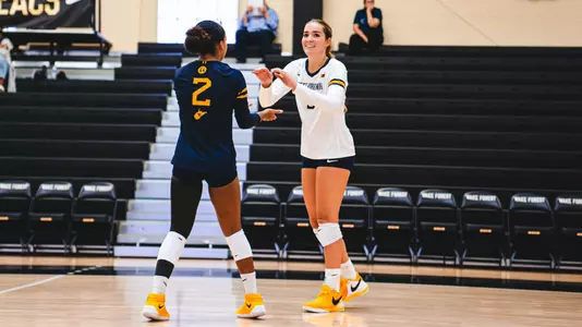 Sydney Reed and Alexis Finnvold high fiving