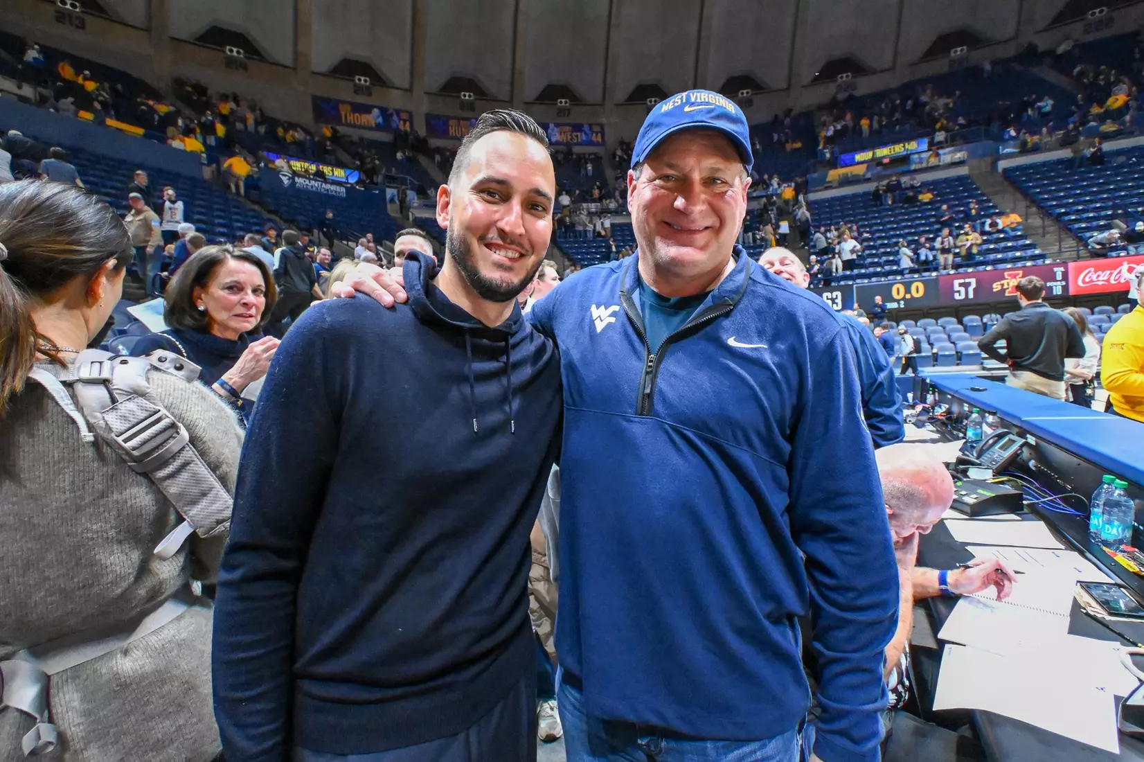 Jonnie West and head football coach Rich Rodriguez.