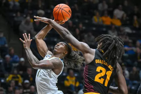Javon Small drives to the hoop.