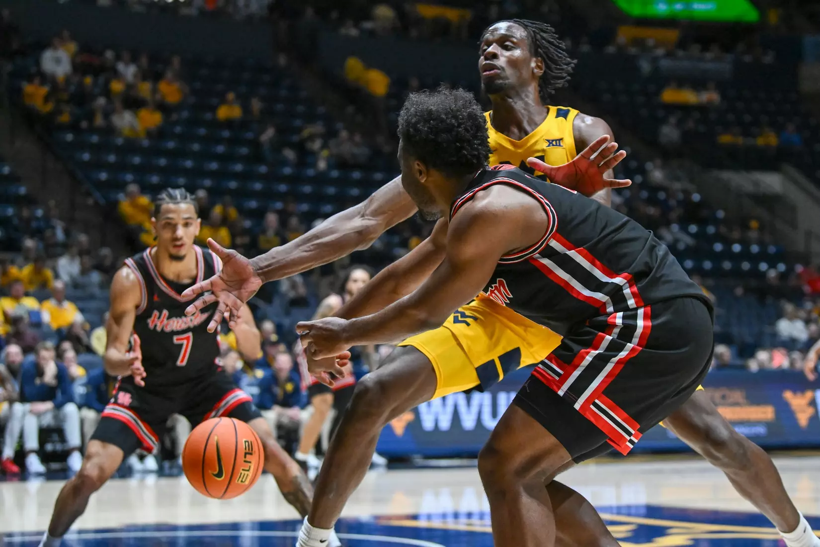 Toby Okani applies backcourt pressure during second half action.