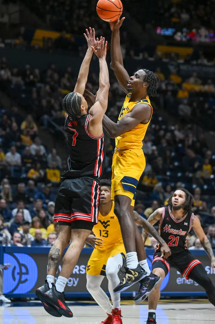 Toby Okani scores two points.