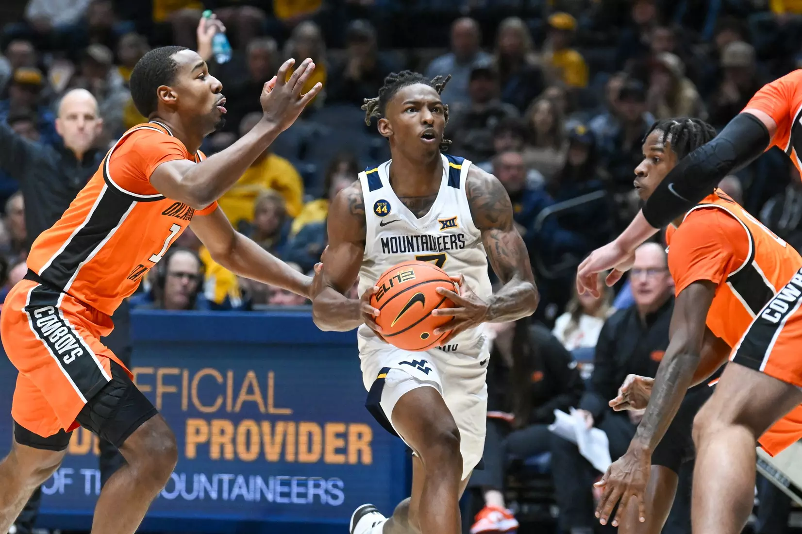 Javon Small drives to the basket during first half action against Oklahoma St.