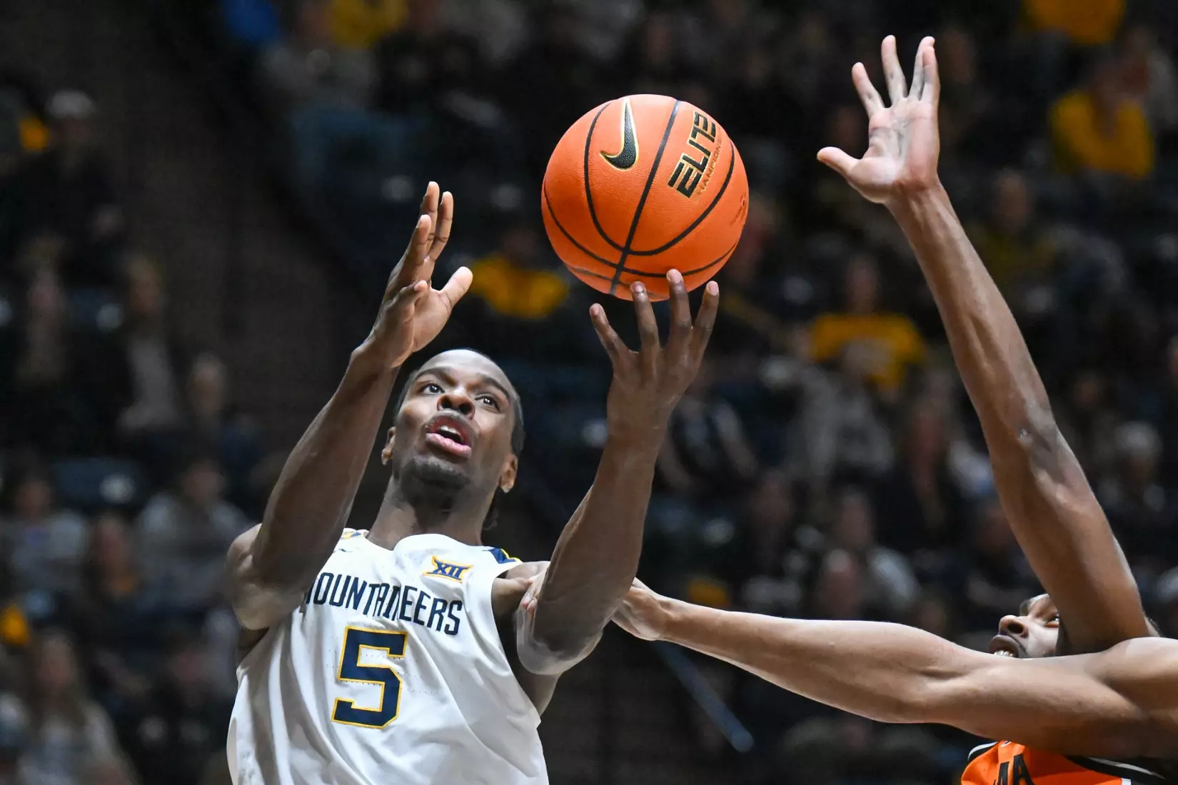 Toby Okani shoots during second half action against Oklahoma St.