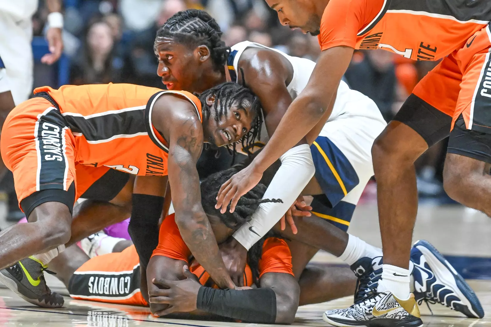 Eduardo Andre fights for a loose ball during second half action against Oklahoma St.