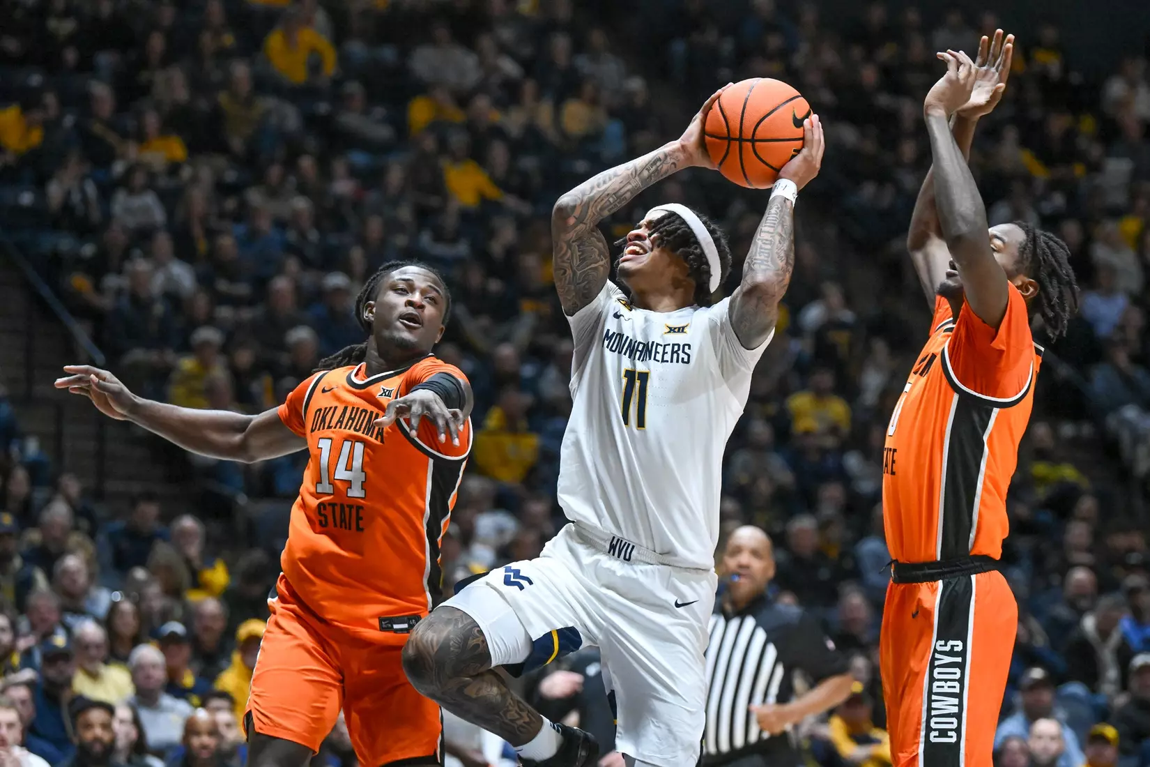 Jonathan Powell drives during second half action against Oklahoma St.