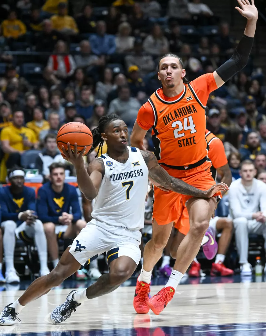 Javon Small drives in the paint during second half action against Oklahoma St.