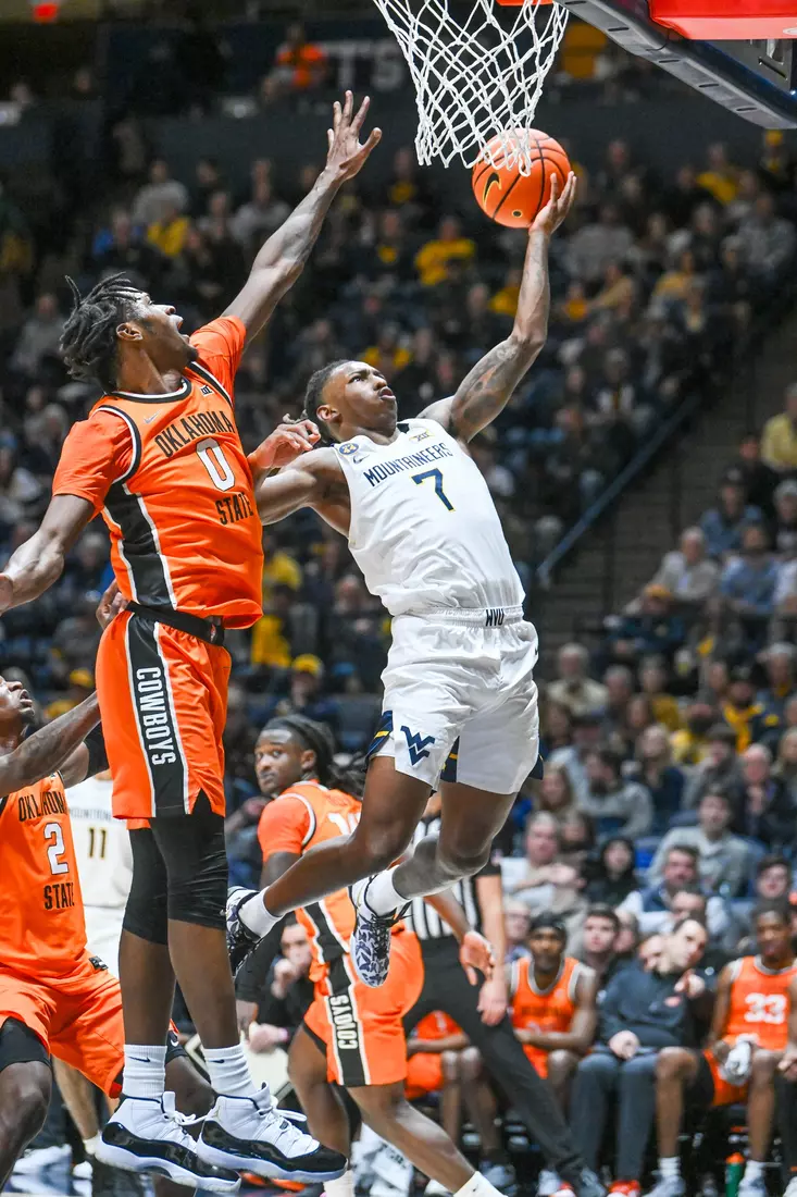 Javon Small scores during first half action against Oklahoma St.