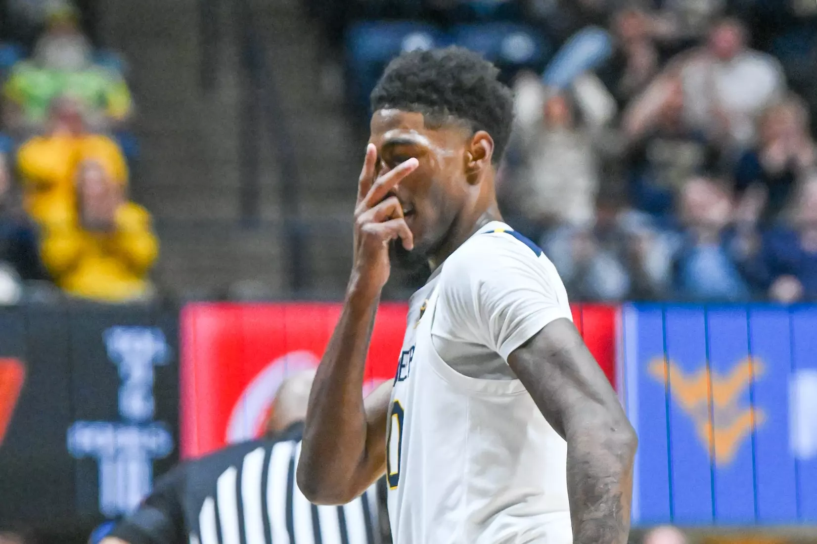 Sencire Harris celebrates. a three-pointer during first half action against Oklahoma St.