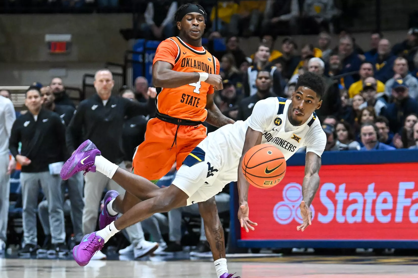 Sencire Harris dives to make a pass during first half action against Oklahoma St.