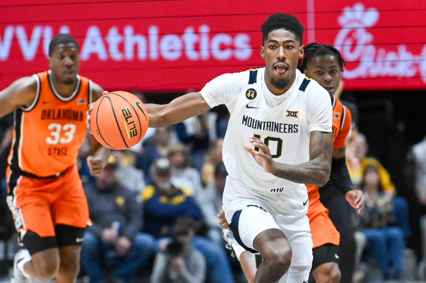 Sencire Harris drives the ball up the court during first half action against Oklahoma St.