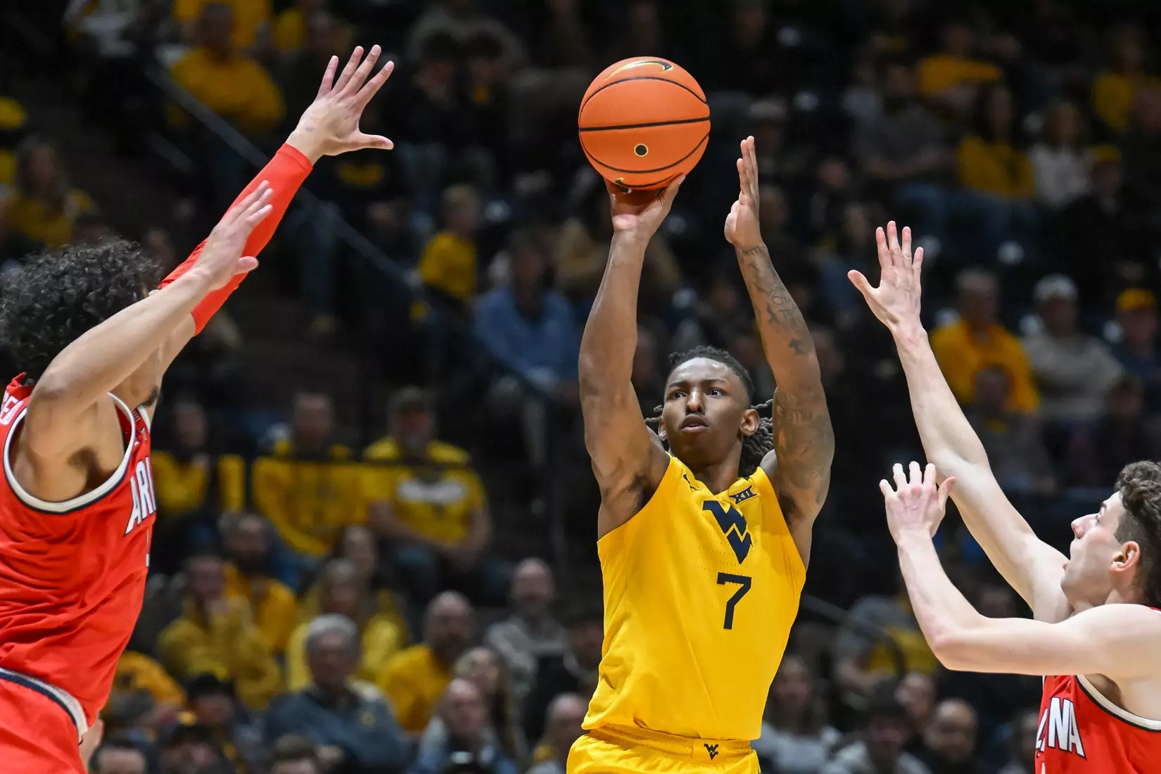 Javon Small hits a three-pointer.