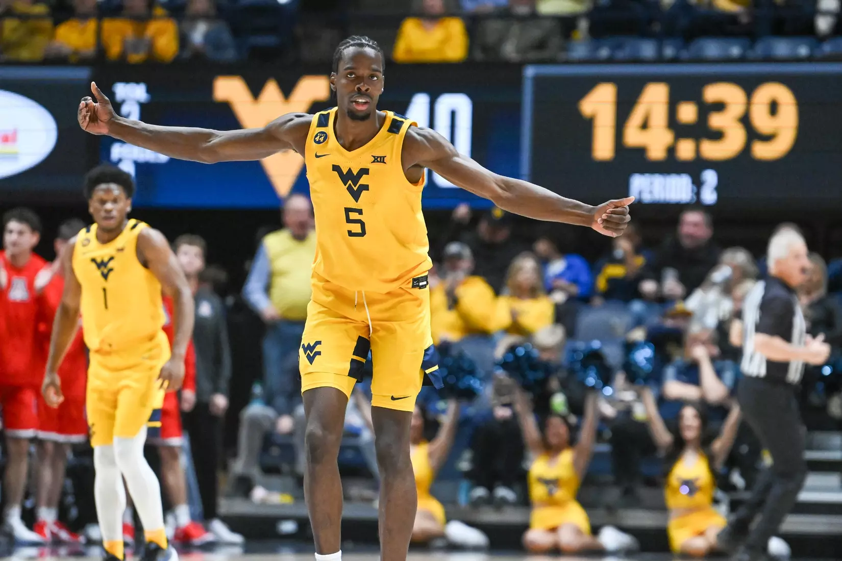 Toby Okani celebrates as the Mountaineers cut the lead to five in the second half.