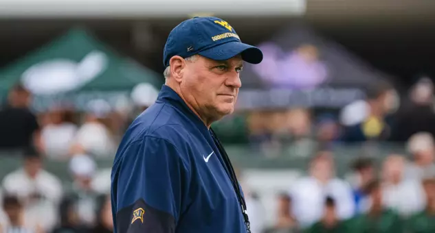Head coach Rich Rodriguez looks on as the Mountaineers prepare for their game against Ohio in Athens, Ohio, on Sept. 6, 2025.