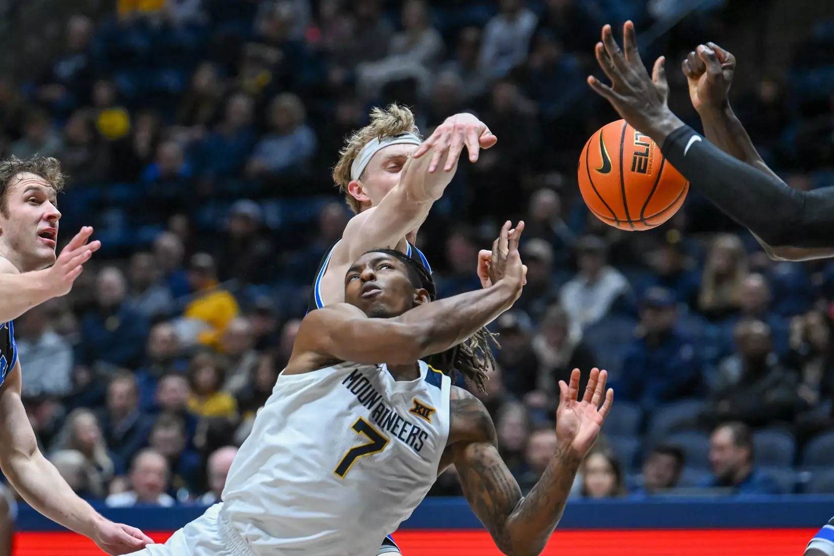 Javon Small flies through the paint.