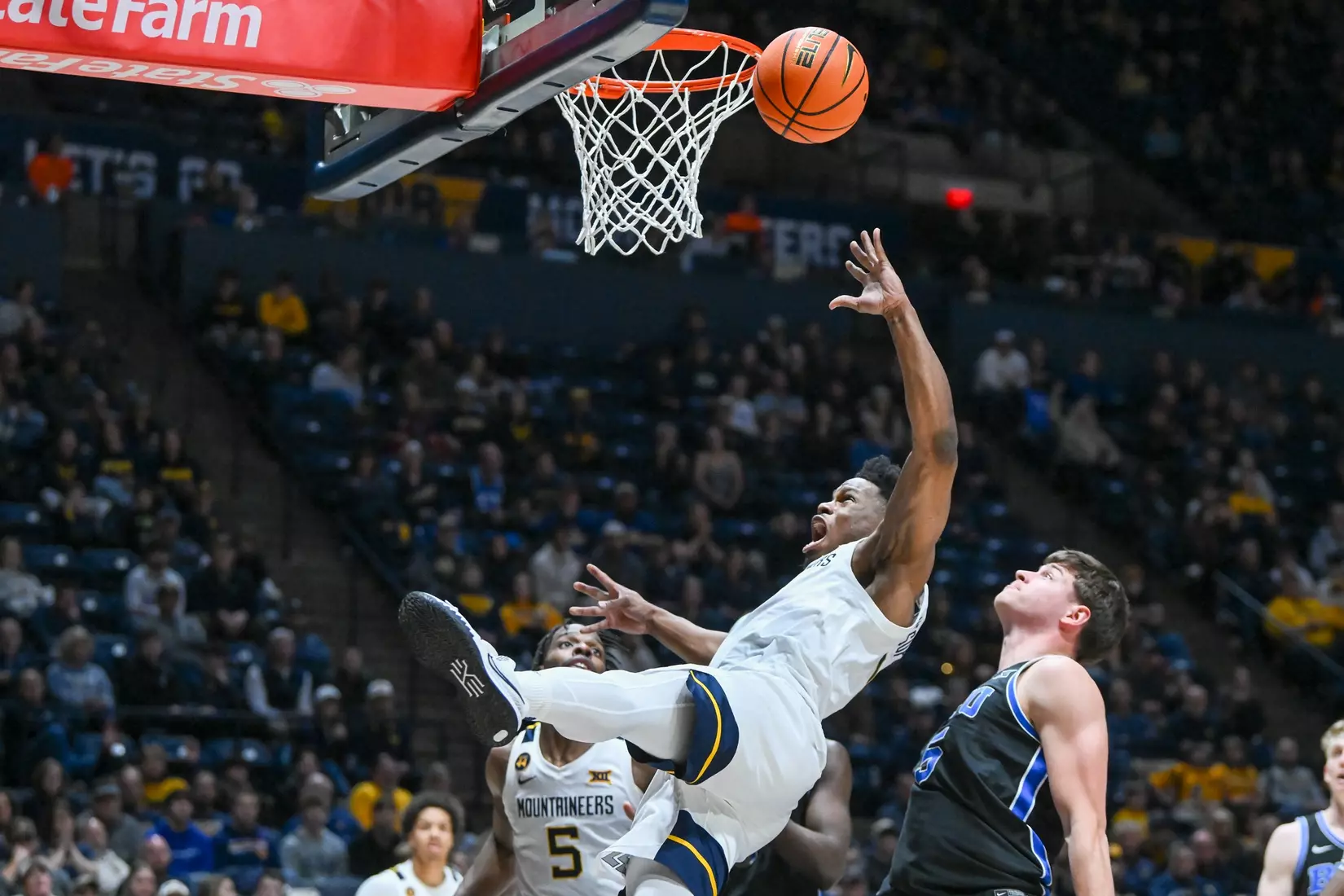 Joseph Yesufu is fouled while shooting.