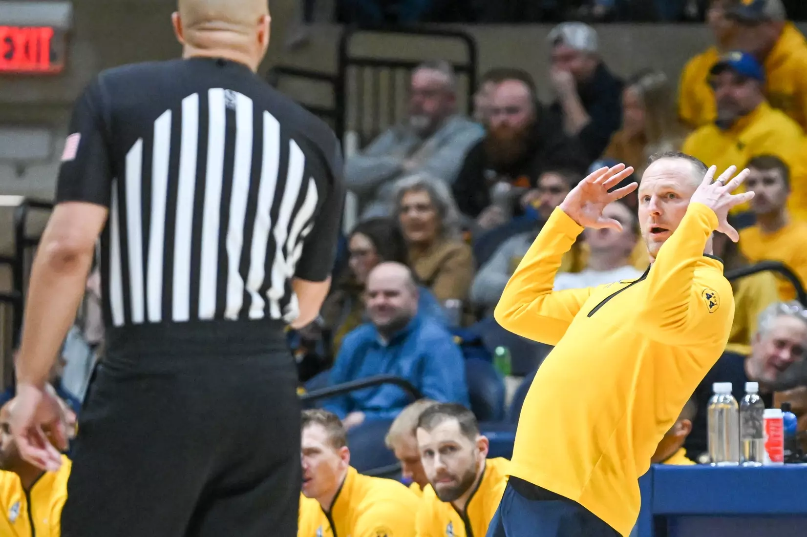 Head coach Darian DeVries questions a call.