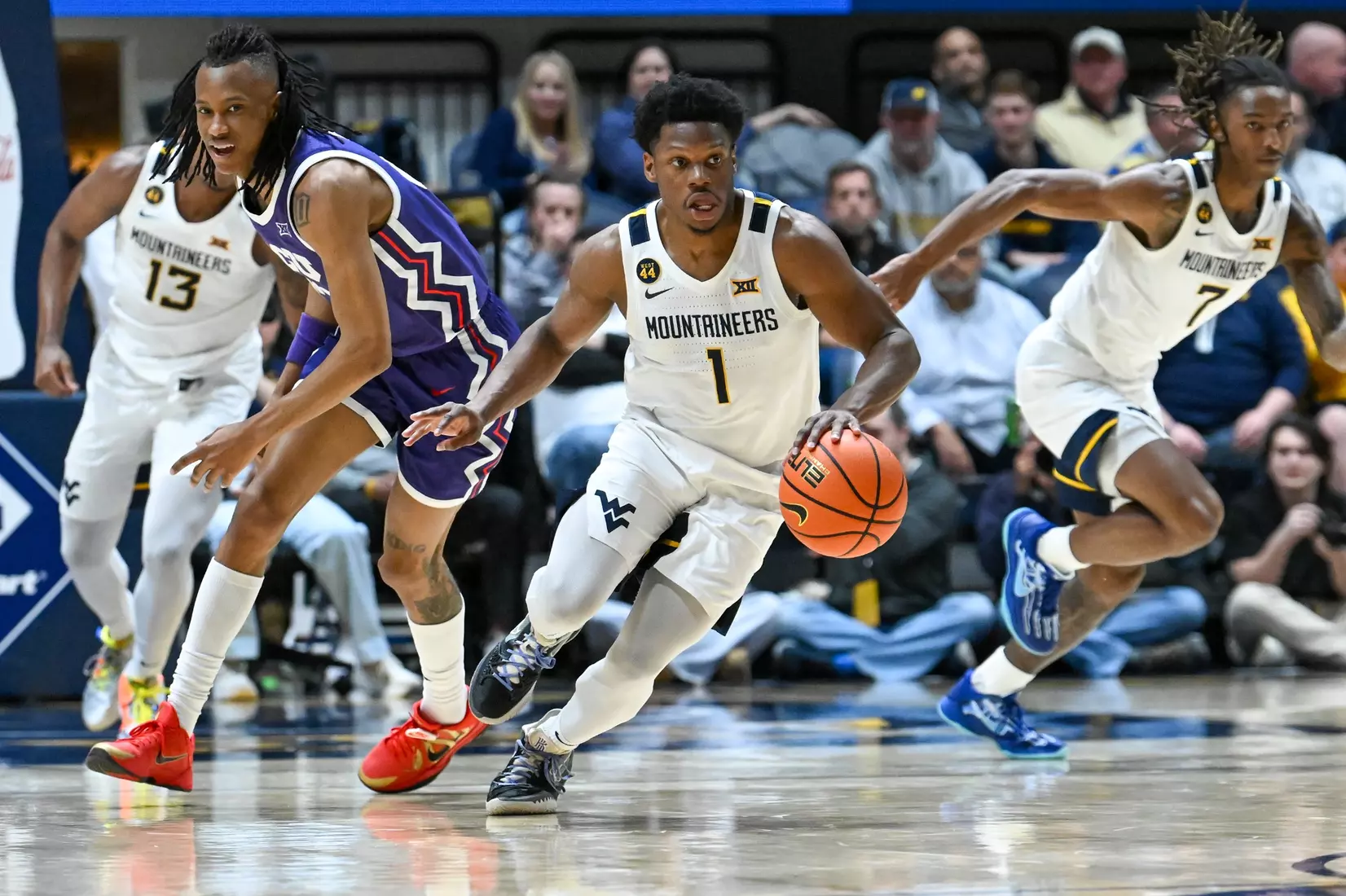 Joseph Yesufu makes the steal and starts the fast break.