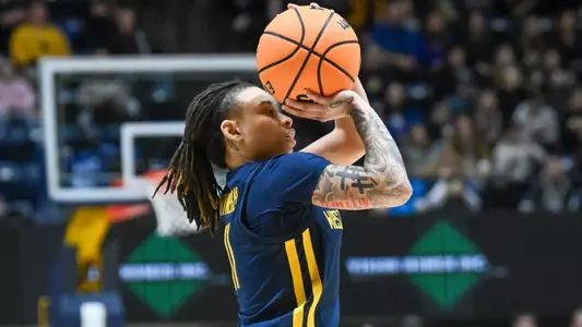 JJ Quinerly shoots for three.