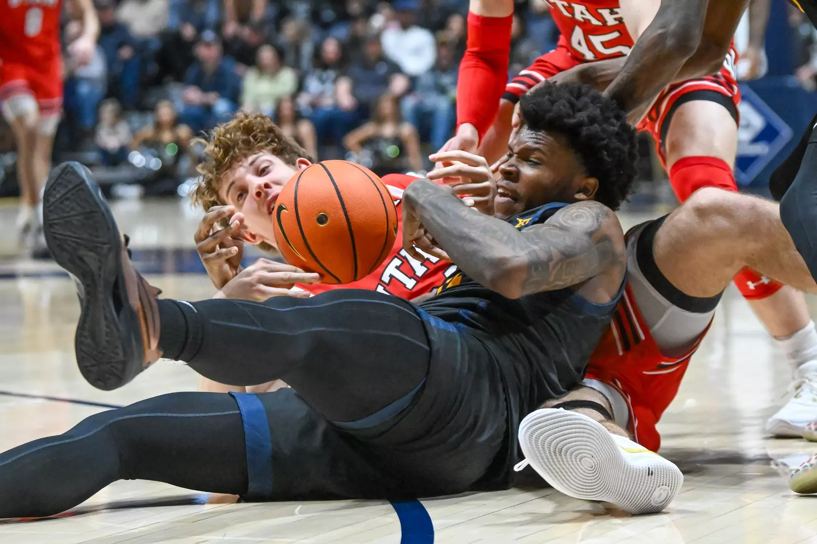 Amani Hansberry fights for a loose ball.
