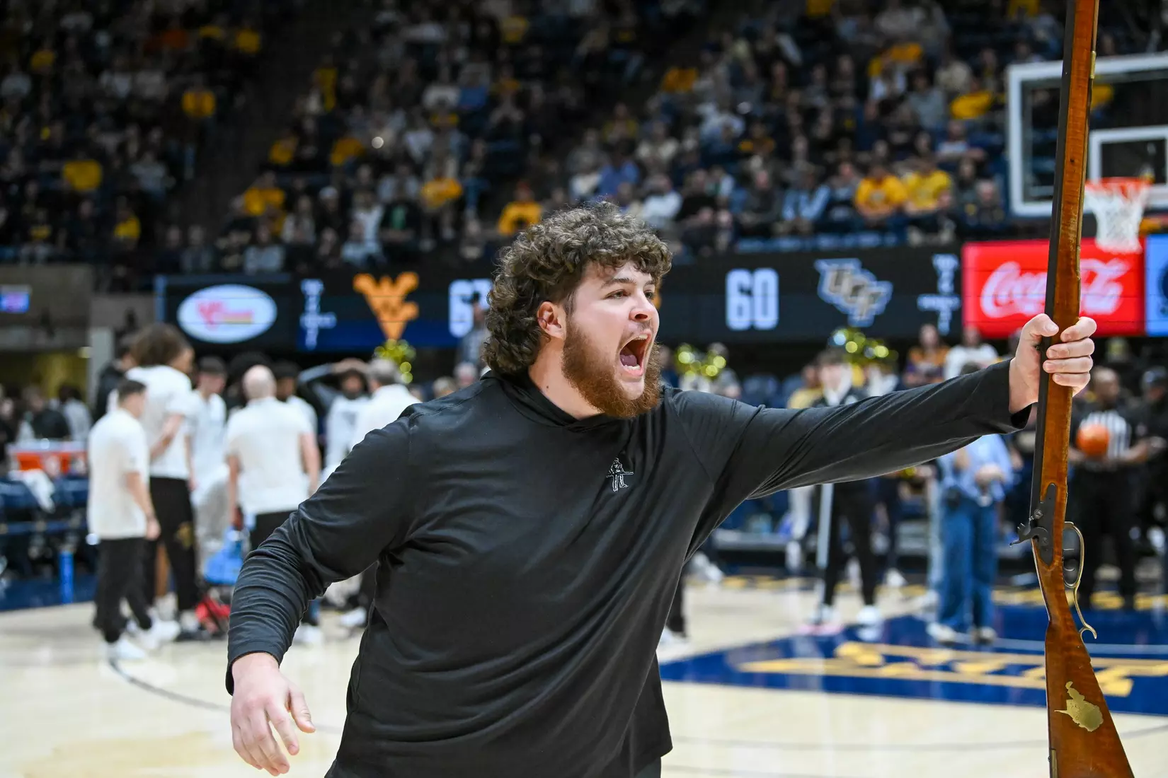 Cade Kincaid, new Mountaineer mascot, leads a cheer.