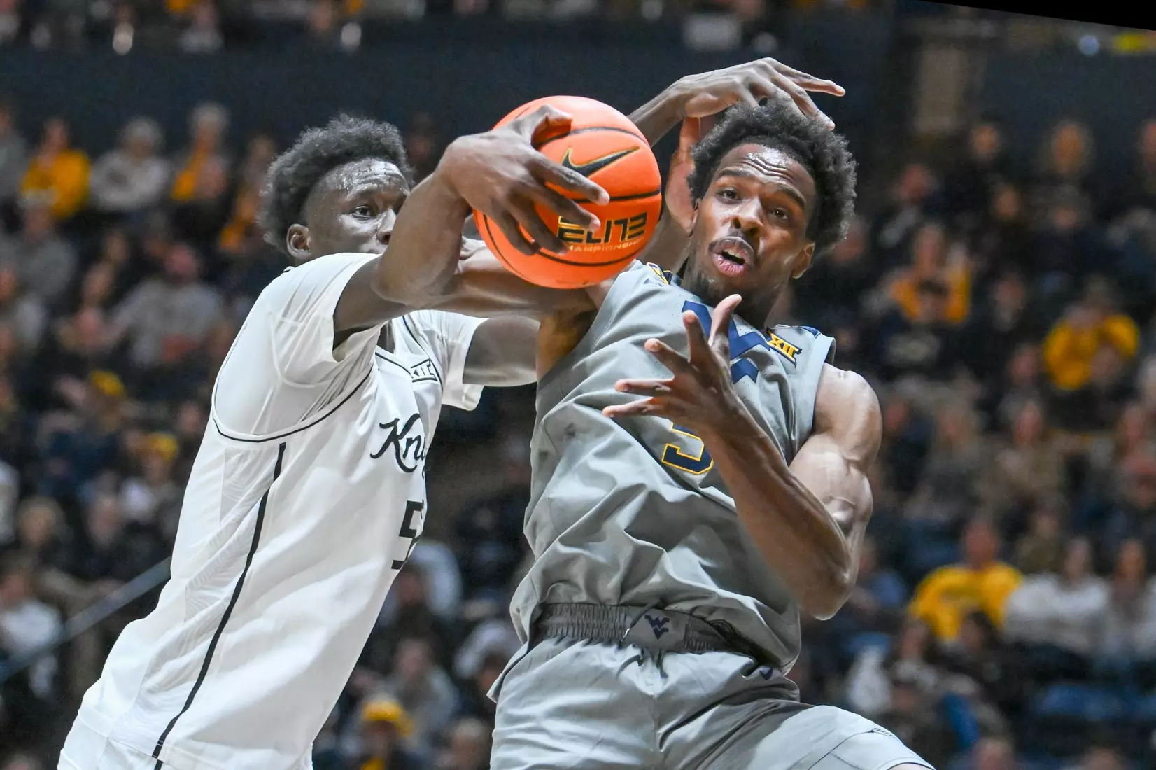 Toby Okani grabs a rebound.