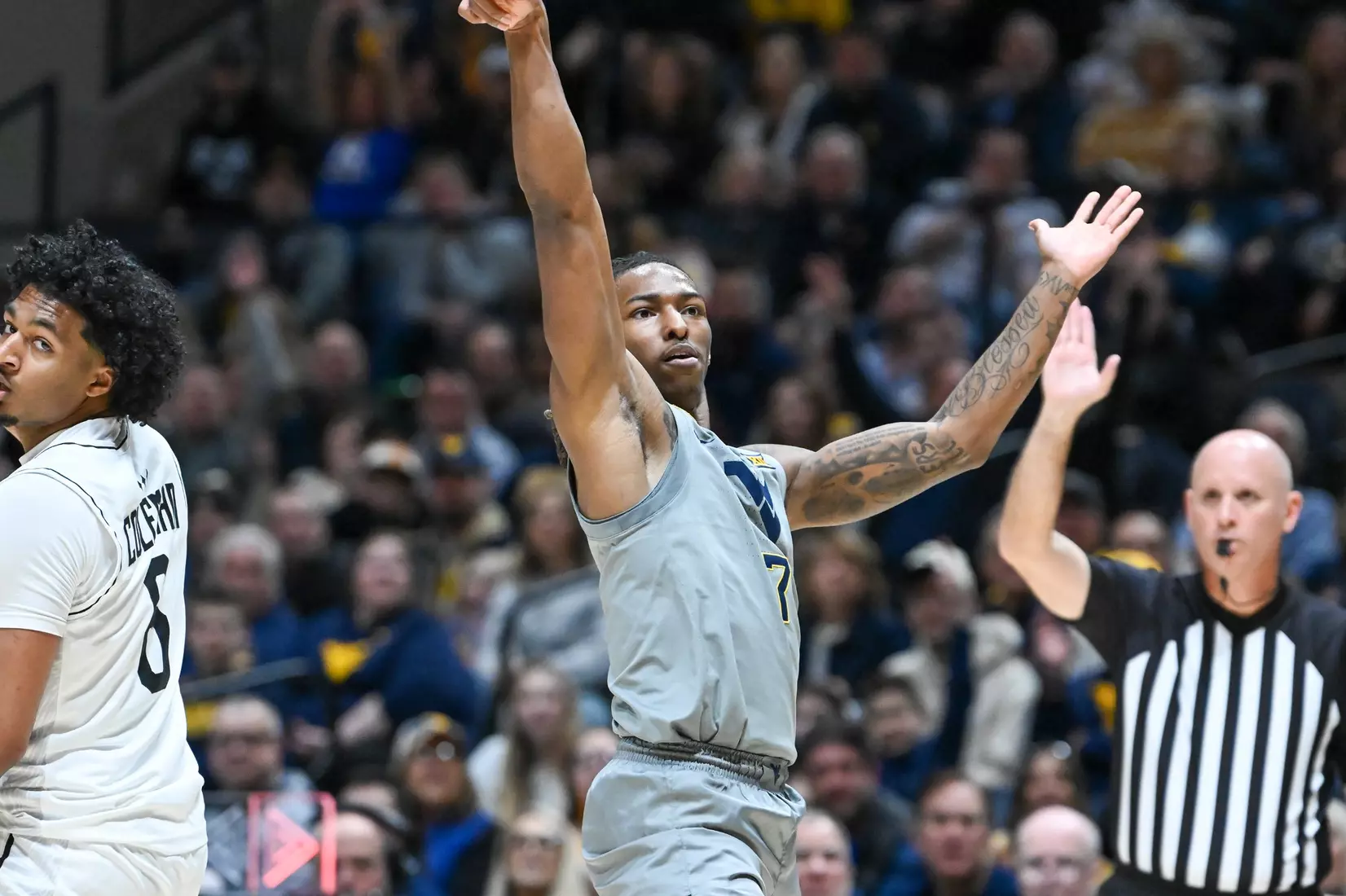 Javon Small holds the three-pointer pose.