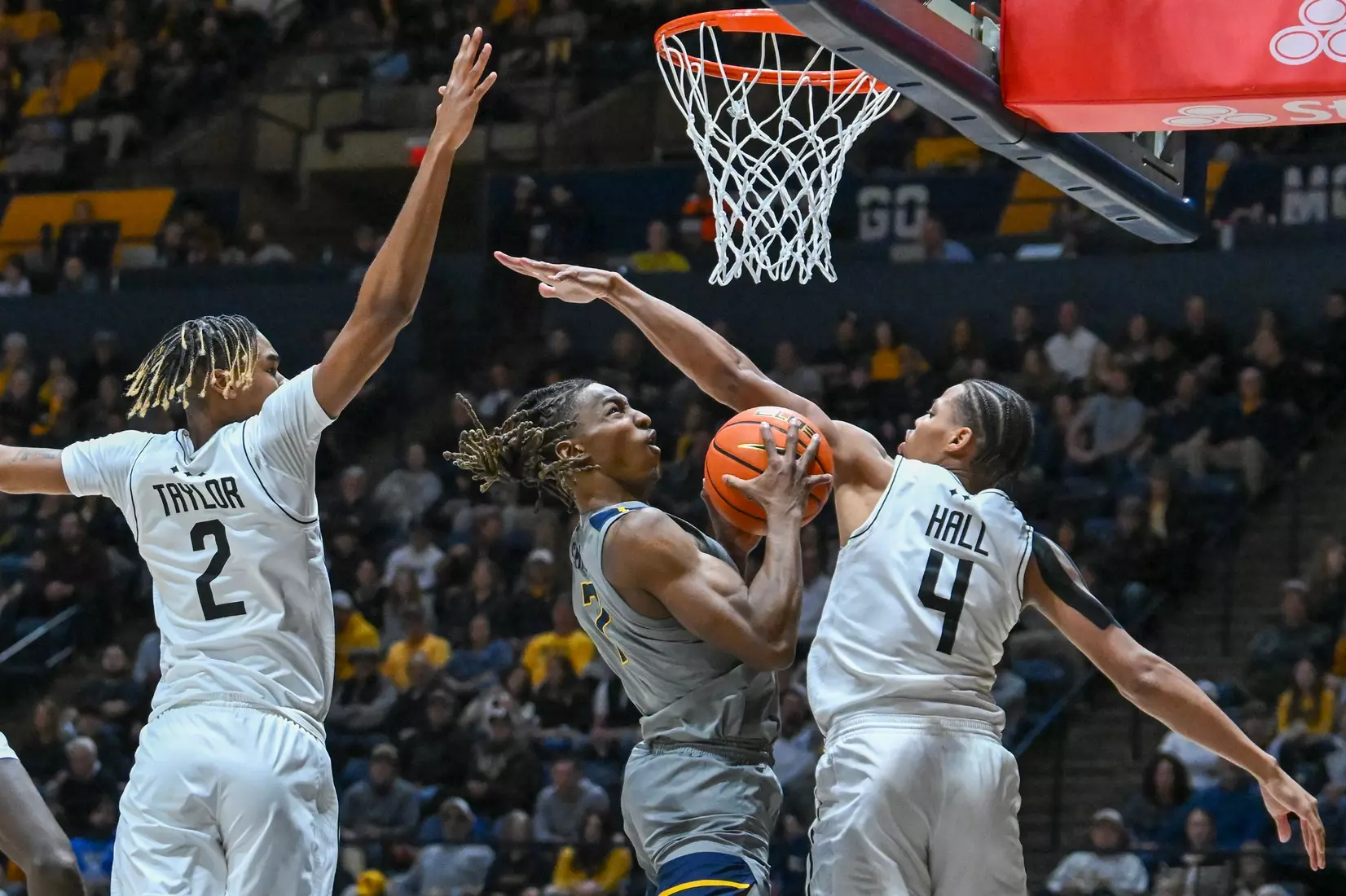 Javon Small works his way through traffic.
