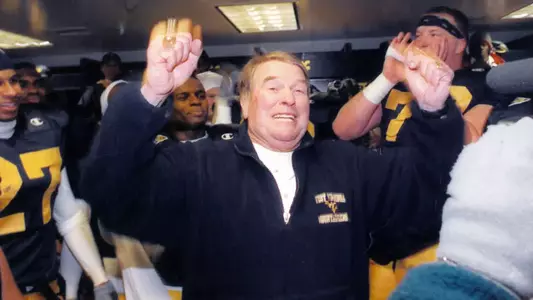 Coach Don Nehlen celebrates his final victory at West Virginia's coach following the Mountaineers' 2000 Music City Bowl triumph over Ole Miss.