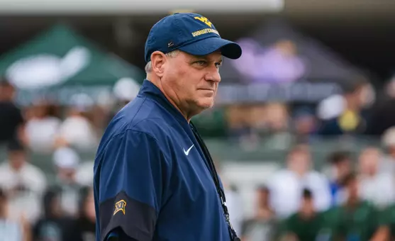 Head coach Rich Rodriguez looks on as the Mountaineers prepare for their game against Ohio in Athens, Ohio, on Sept. 6, 2025.