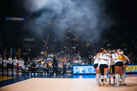 The WVU Volleyball is huddled up before its match against TCU on Sept. 27