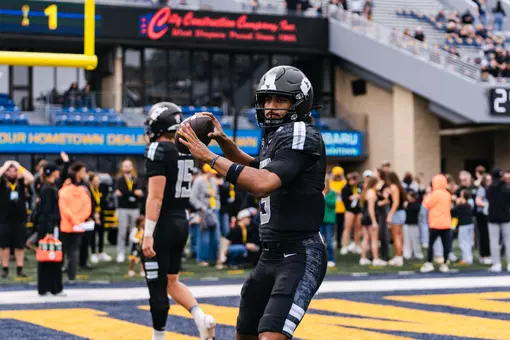 West Virginia players warm up prior to their game against Arizona at Milan Puskar Stadium in Morgantown, W.Va., on Oct. 10, 2026.