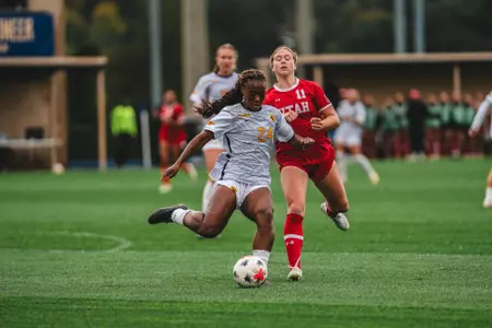 Nyema Ingleton kicks a ball during a game at Dick Dlesk Soccer Stadium.