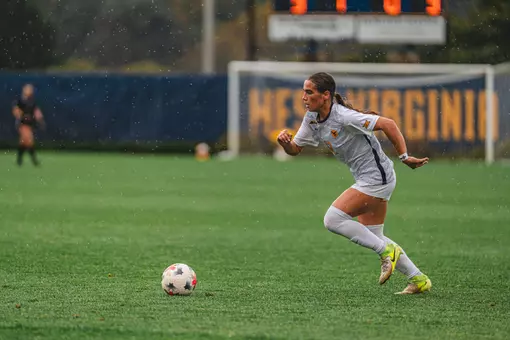 Olivia Shertzer dribbles the ball during a game at Dick Dlesk Soccer Stadium.