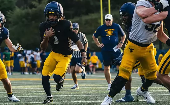 Quarterback Michael Hawkins Jr. runs the football during practice on the Steve Antoline Family Practice Facility on Tuesday, October. 13, as West Virginia prepares to face Cincinnati on Saturday in Milan Puskar Stadium.
