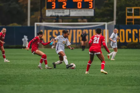 Layla Thompson dribbles the ball during a match at Dick Dlesk Soccer Stadium.