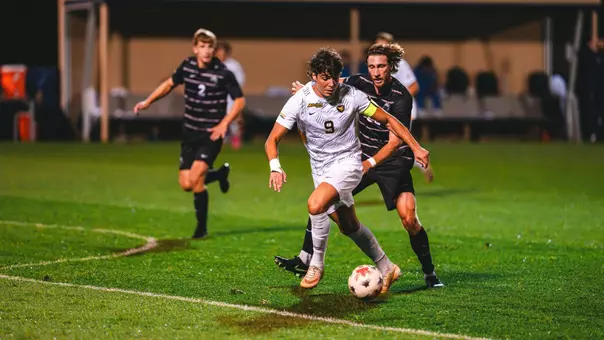 Pablo Pozos battles for the ball against South Carolina